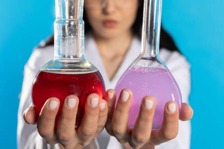 Optical comparison of two substances made in the laboratory by a young intern.の写真素材