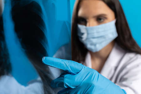The doctor is closely watching the lungs of a patient with a serious disease.