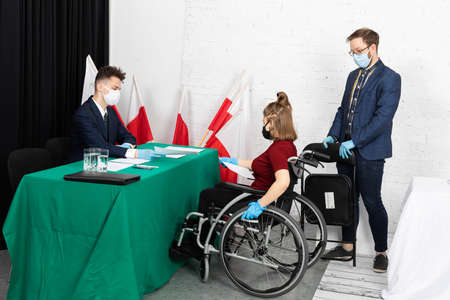 A woman in a wheelchair. Presidential elections in Poland. Polling station adapted for invalids.