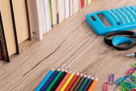 New school supplies. Books arranged in a row. Equipment for every school student.