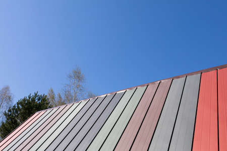 Colorful flat sheets are folded from time to time. Airtight roof in a summer house.の写真素材