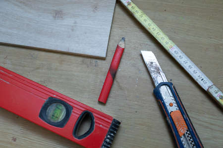 On the table lies a few measuring tools necessary for any construction work at home or on the...