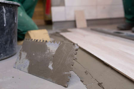 Hand tool. Metal trowel with square teeth cut out. A tool used for tiling cement and terracotta with...
