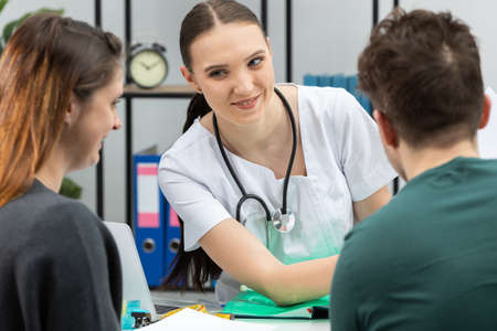A gynecologist shows a surprising result of a test, a patient who is pregnant. A married couple in...