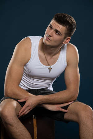 Seated portrait of a young and handsome model from Europe.