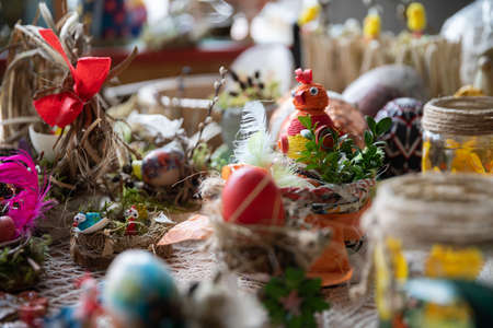 Handmade Easter centerpiece in spring colors - a hen in the nest.