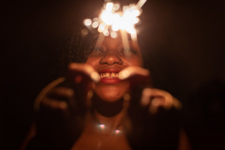 Unusual cold fires and bake a dark-skinned girl on New Years Eve.の写真素材
