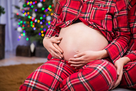 close-up on the large pregnant belly of a mom-to-be