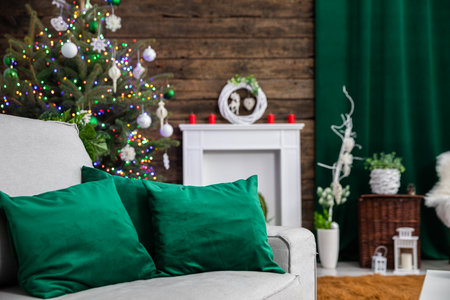 Green pillows in a living room decorated for Christmas.の写真素材