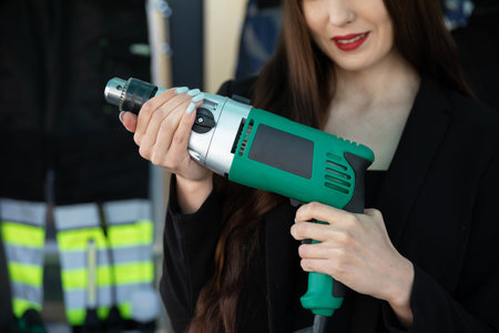 A Professional Woman Utilizing a Power Tool in a Contemporary and Modern Setting