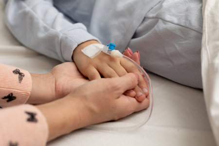 The Comforting Touch An Indelible Expression of a Parents Love in a Hospital Settingの写真素材