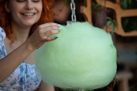 Experience the delightful joy of cotton candy that brings a touch of fun and excitementの写真素材
