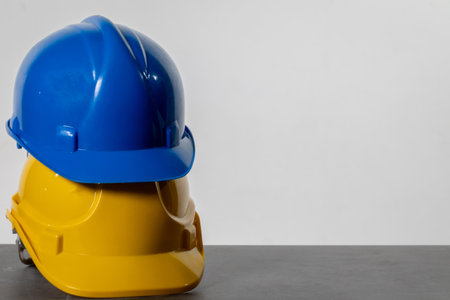 Various Colorful Construction Helmets Arranged Neatly on a Table for Easy Access and Use