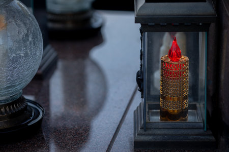 An Illuminated Lantern Featuring a Decorative Flame Candle for Ambianceの写真素材