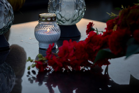 Stunning and Elegant Evening Decor featuring a Beautiful Candle and Bougainvillea Flowersの写真素材