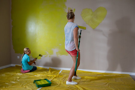 Engaging in Creative Home Painting Activities Together with Love and Joy for All to Enjoyの写真素材