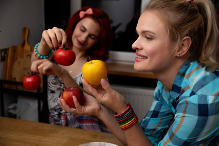 Enjoy the Fruit Fun A Bright Display of Colorful Apples in a Cozy Kitchen Settingの写真素材