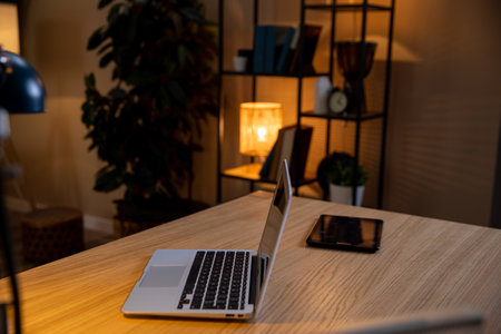 Create a Cozy Home Office Setup Featuring a Laptop and Tablet for Productive Work Daysの写真素材