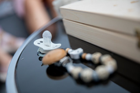 Baby Accessories A Stylish Array of Pacifier and Teething Beads Arranged on a Table