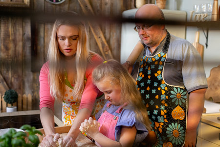A Family Cooking Together while Creating Cherished Memories in a Cozy Kitchen Setting