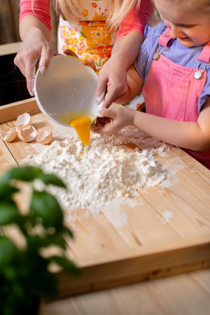 Baking Fun A Parent and Child Making Delicious Dough Together for Joyful Memoriesの写真素材