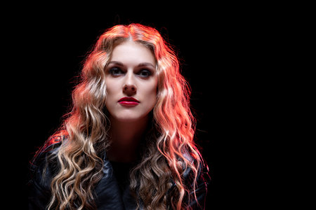 A Striking Portrait Featuring Dramatic Lighting and Bold, Vibrant Colors That Captivateの写真素材