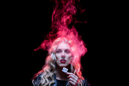 An Ethereal Portrait Enhanced with Stunning Colorful Smoke Effects and Dramatic Lightingの写真素材