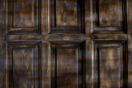 An Elegant Dark Wooden Panel Background Perfect for Various Design Projects and Ideasの写真素材
