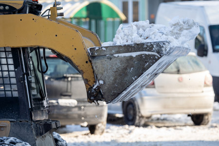 Snow Removal Equipment Actively Working in an Urban Landscape During the Winter Season