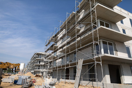 A Modern Apartment Building Currently Under Construction, Complete with Scaffolding in Place