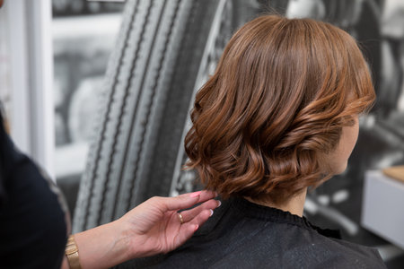 The Process of Hair Styling in a Salon Utilizing Modern and Innovative Techniques and Approachesの写真素材