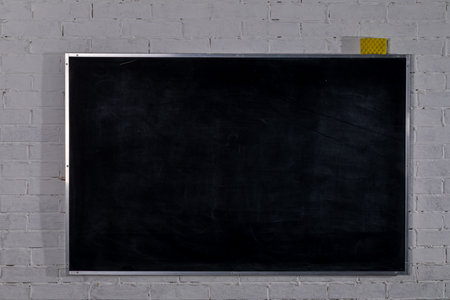 An Empty Blackboard in a Modern Classroom Environment Suitable for Learning and Creativityの写真素材