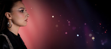 A Stylish Woman Posed Elegantly Against a Striking Cosmic Background That Inspires Wonderの写真素材