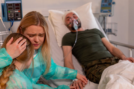 A heartfelt hospital scene highlights the vital family support in times of crisis and healingの写真素材