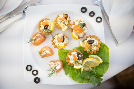 Delightful and Beautifully Elegant Seafood Appetizers Perfectly Arranged on a White Plateの写真素材