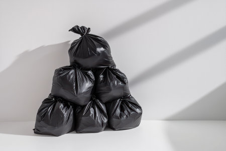 Piled Black Garbage Bags artfully arranged in a Modern Setting or contemporary spaceの素材