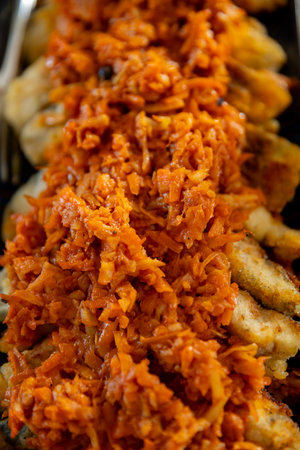 Enjoy delectable dumplings topped with a flavorful carrot relish, an unforgettable treatの写真素材