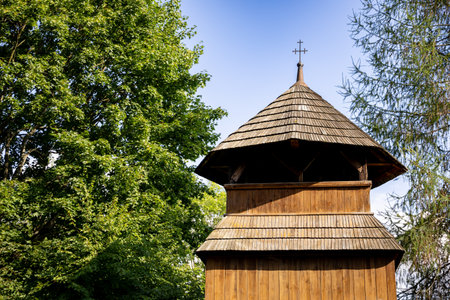A Charming Wooden Structure Beautifully Surrounded by Lush Greenery and Natures Beautyの写真素材