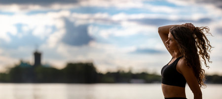 Dynamic and Inspiring Lifestyle Portrait by the Beautiful Waterside Movement and Inspirationの写真素材