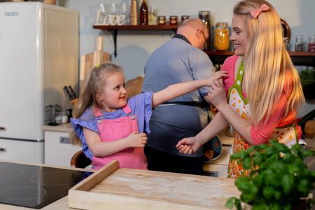 A Joyful Family Cooking Together in Their Warm and Inviting Home Kitchen, Creating Memories