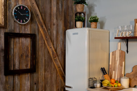 Charming Rustic Kitchen Decor Featuring a Stylish Vintage Refrigerator and Unique Accessories