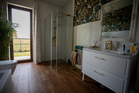 Sunny rustic space with nature decor, Lightfilled country style bathroom with tranquil ambiance, Sundrenched rustic washroom featuring open doorway and countryside viewsの写真素材