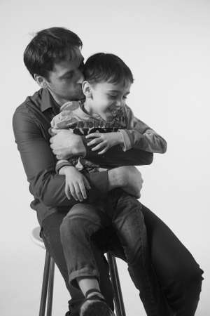 Black and white photo of happy and joyful father with six years old son, father's dayの写真素材