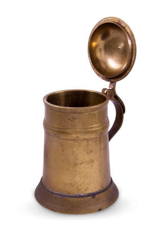 Vintage brass copper old pint or tankard for beer isolated on whiteの写真素材
