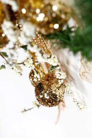 Shiny Christmas decoration with golden ball on white background