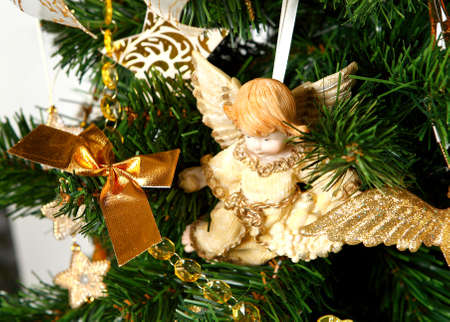 Decorated Christmas tree. Artifical. Green and golden colors