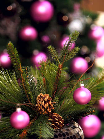 Artificial spruce tree, pink ball, blurred backgroundの写真素材