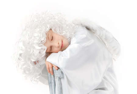 White angel with white wings sleeping isolatedの写真素材