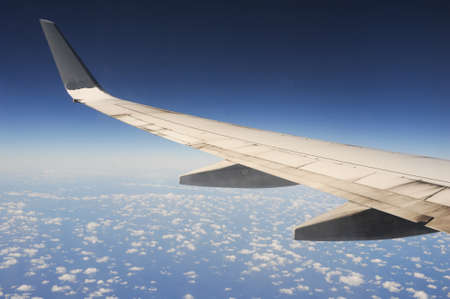 The wings of an airplane on the sky