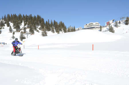 Men on snowmobile at Engelberg on the Swiss alpsのeditorial素材